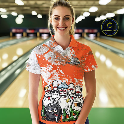 Female model front view at bowling lane wearing white polo with orange and white splatter pattern, cartoon bowling pins and bowling ball surrounded by beer bottles