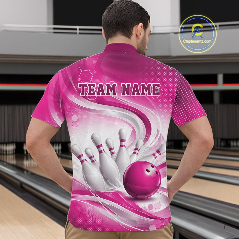 Male model standing in a bowling lane wearing a white and pink bowling quarter-zip shirt featuring abstract wave lines and a glossy bowling ball striking pins on the front.