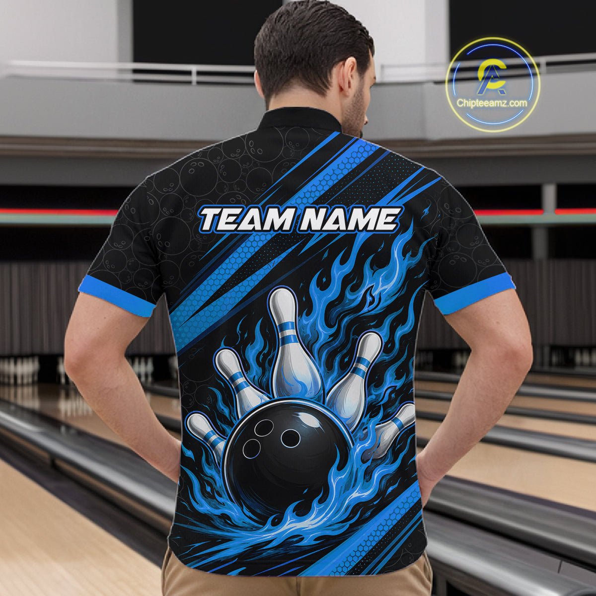 A man viewed from behind wearing a black bowling-themed short-sleeve quarter zip shirt with blue flame graphics, bowling pins, and a black bowling ball design. 