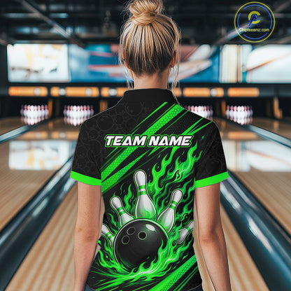 A woman viewed from behind wearing a black short-sleeve bowling polo shirt with bright green flame graphics, bowling pins, and a bowling ball design on the back, with 'TEAM NAME' printed across the upper back
