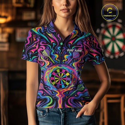 A woman wearing a short-sleeve polo shirt with a vibrant, psychedelic darts-themed graphic print. The shirt features a dartboard motif surrounded by swirling neon colors like pink, blue, purple, green, and yellow, with the text 'Your Name' printed on the chest.