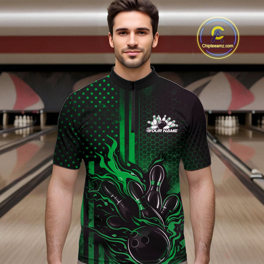 Male model wearing a black and green bowling quarter-zip shirt at a bowling lane with patriotic bowling strike artwork and fiery graphics.