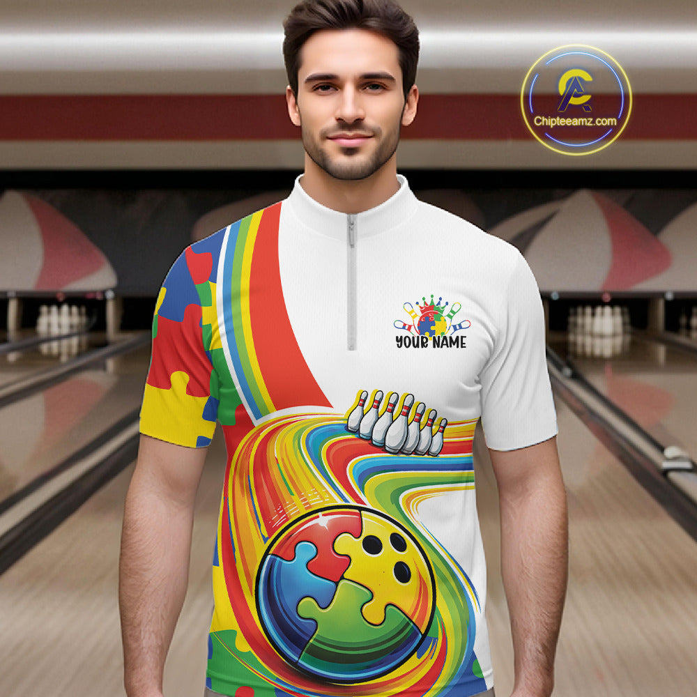 At Bowling Lane, Front View Male Model In Quarter-Zip Shirt Displaying Autism-Themed Bowling Lane Illustration With Multicolor Puzzle-Inspired Graphics
