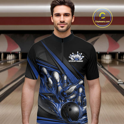 Male model in a bowling lane wearing a black quarter-zip shirt, blue flame bowling ball hitting pins with dynamic geometric stripe visuals.