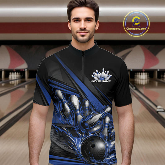 Male model in a bowling lane wearing a black quarter-zip shirt, blue flame bowling ball hitting pins with dynamic geometric stripe visuals.