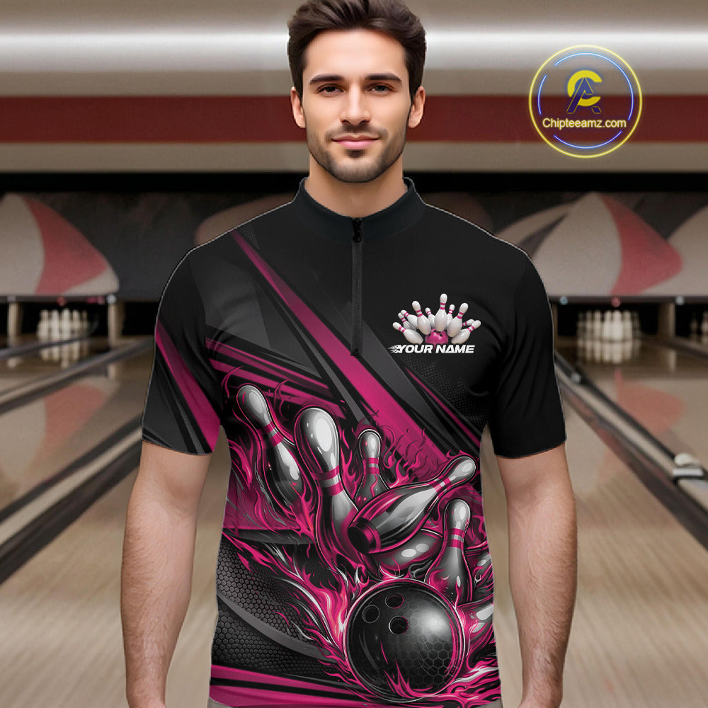 Male model in a bowling lane wearing a black quarter-zip shirt, hot pink flame bowling ball hitting pins with dynamic abstract stripe graphics.