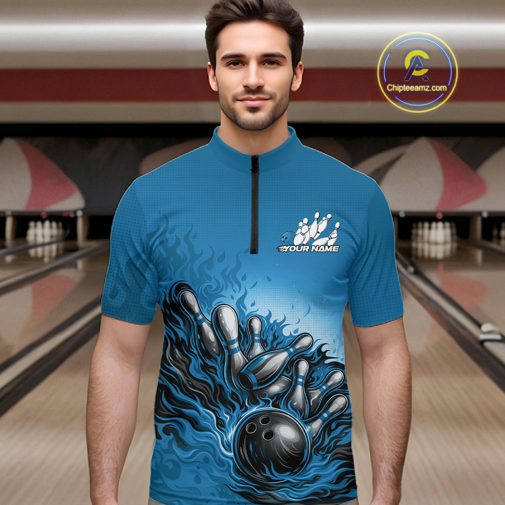 In a bowling lane, male model wearing a quarter-zip shirt, raccoon wearing sunglasses and patriotic bandana leaning on a bowling ball with playful illustrated design.