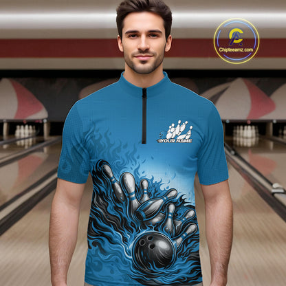 In a bowling lane, male model wearing a quarter-zip shirt, raccoon wearing sunglasses and patriotic bandana leaning on a bowling ball with playful illustrated design.