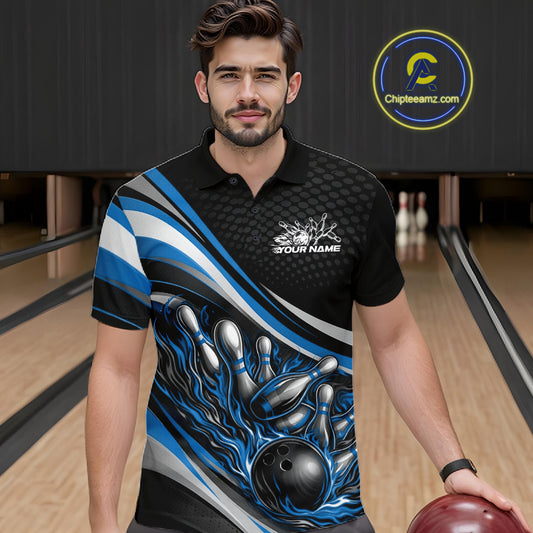 In a bowling lane, male model wearing a black and blue polo shirt, flame bowling ball striking pins with glowing fire-inspired sports graphics.