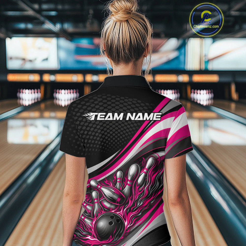 Back view female model in black and pink quarter zip bowling shirt in bowling lane, flame bowling ball and pins graphic design