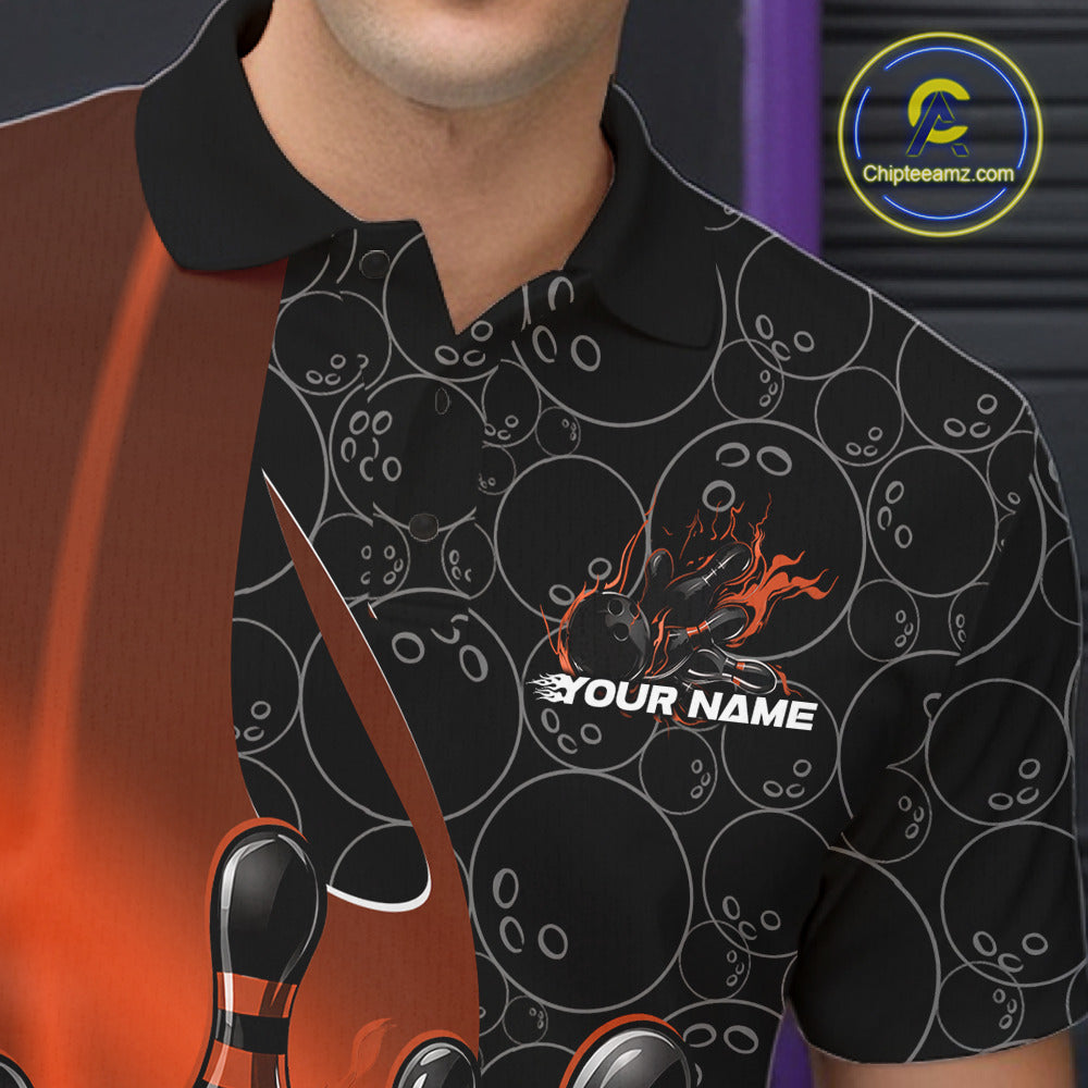 Close-up view of the left chest of a black and orange bowling polo shirt showing gradient bowling ball pattern with flaming bowling strike artwork detail.