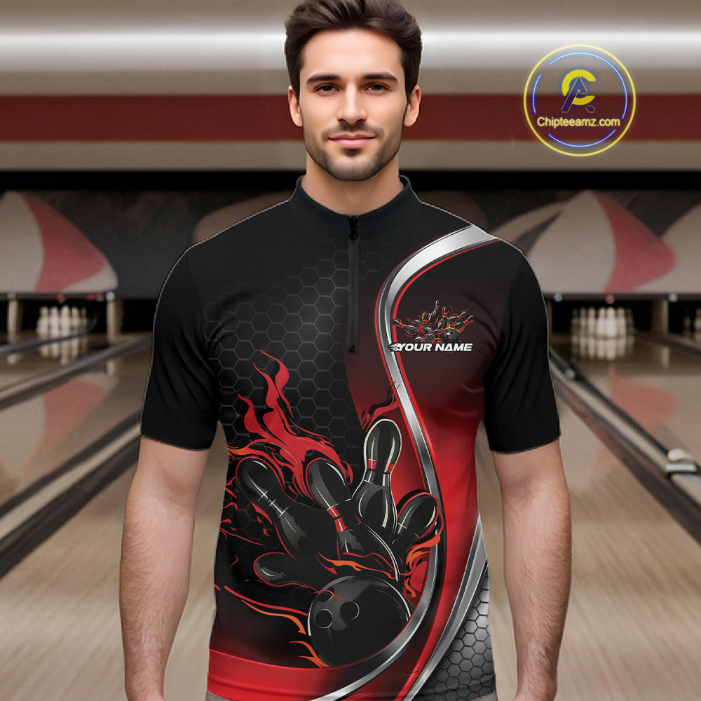 Male model front view at bowling lane wearing black and red quarter zip shirt with flame bowling action dynamic artwork