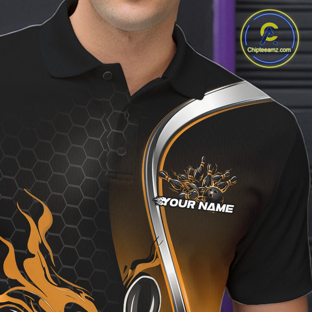 Close-up view of the left chest area of a black and yellow bowling polo shirt showing a flame bowling ball and pins design detail.