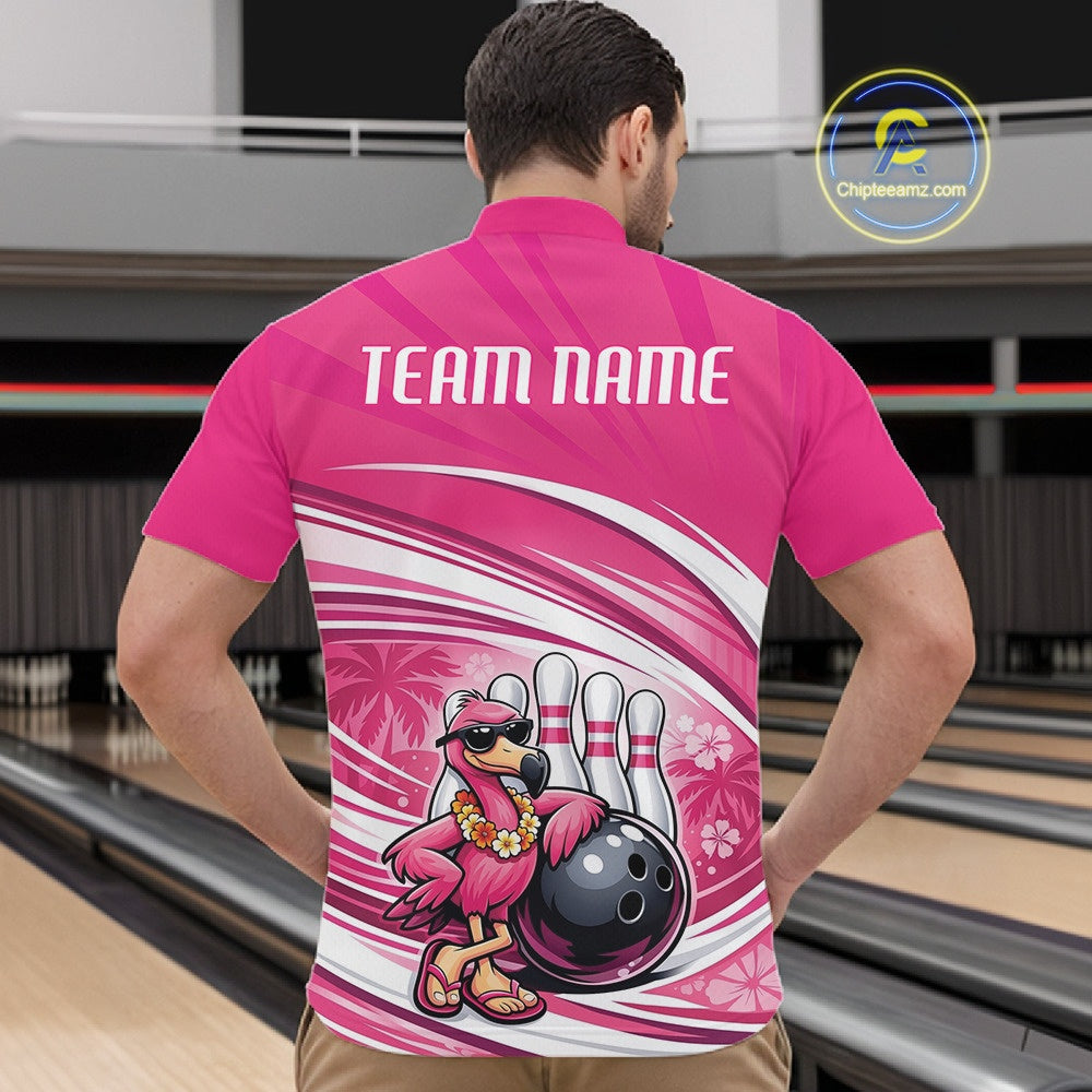 Front view of a male model in a bowling alley wearing a pink quarter-zip shirt featuring tropical flamingo and bowling ball artwork.