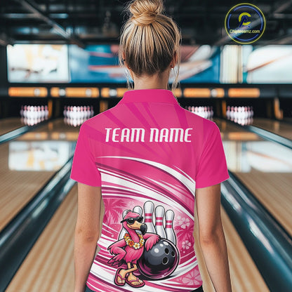 Back view of a female model in a bowling venue wearing a pink quarter-zip shirt featuring a tropical flamingo and bowling ball graphics.