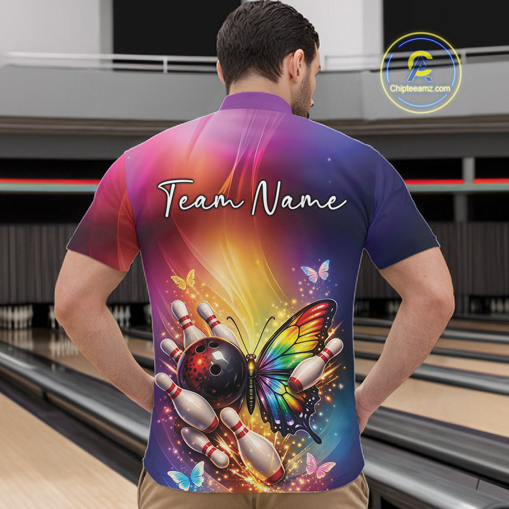 Front view of a male model in a bowling center wearing a quarter-zip shirt showcasing a rainbow butterfly and bowling-themed graphics.
