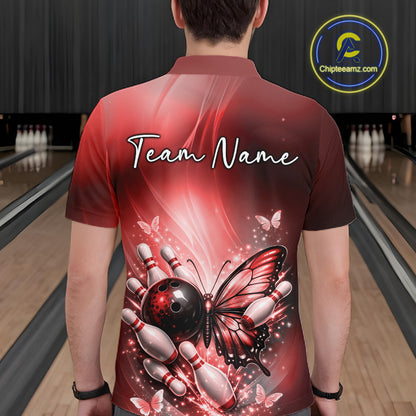 Back view of a male model in a bowling alley wearing a red polo shirt featuring a butterfly beside a bowling ball and bowling pins.