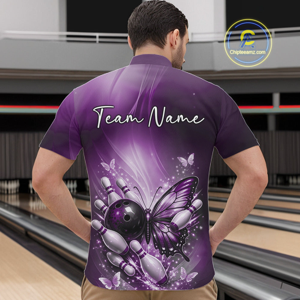 Front view of a male model in a bowling alley wearing a purple quarter-zip shirt showcasing a butterfly beside a bowling ball.