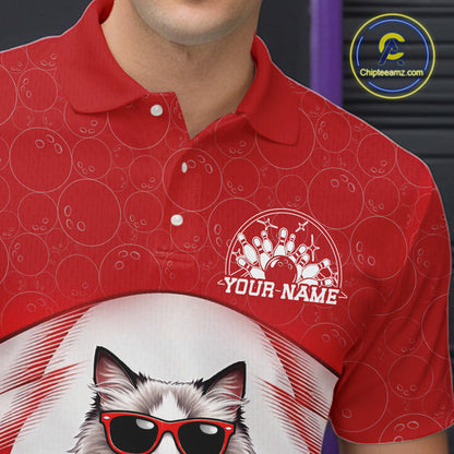 Close-up left chest detail of a white and red bowling polo shirt featuring a ragdoll cat wearing sunglasses and leaning on a bowling ball.