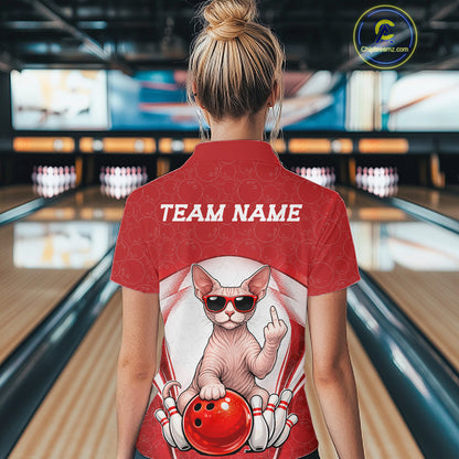 Back view of a female model in a bowling alley wearing a white and red polo shirt featuring a sphynx cat and bowling ball graphics.