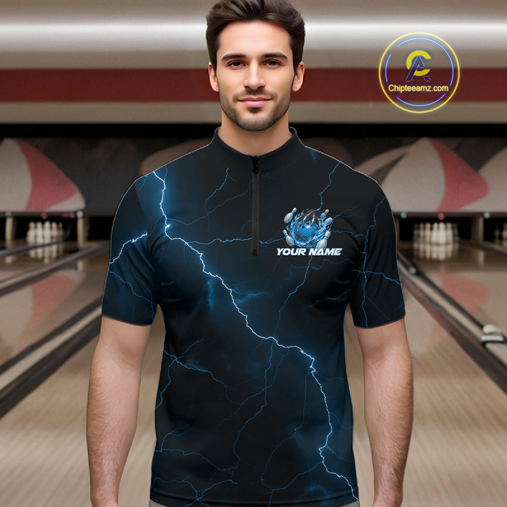 Male model wearing a black and blue bowling quarter-zip with fantasy dragon claw artwork and lightning-inspired graphics.