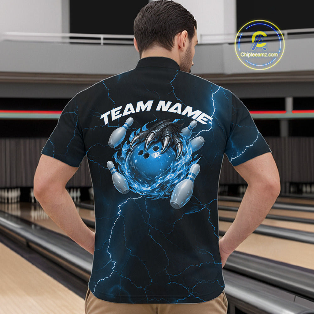 Front view of a black and blue mens quarter-zip showcasing a dragon claw holding a flaming bowling ball with pin accents.