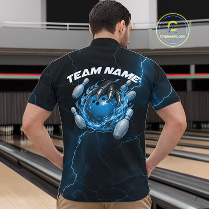 Front view of a black and blue mens quarter-zip showcasing a dragon claw holding a flaming bowling ball with pin accents.