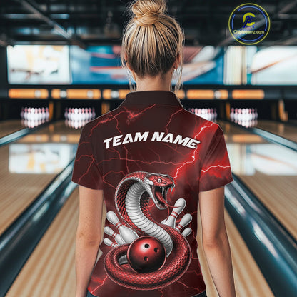 Back view of a womens bowling polo displaying a red cobra wrapped around a bowling ball with scattered pins.