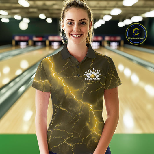 Male model at the bowling lane wearing a quarter-zip with yellow cobra bowling artwork and lightning accents.