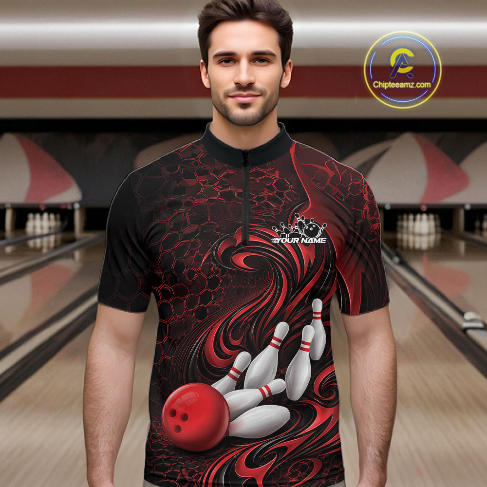 Male model wearing a black and red bowling quarter-zip shirt in a bowling alley featuring a tribal flame bowling ball and pins graphic