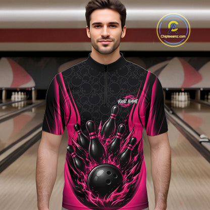 A man wearing a short-sleeve bowling quarter zip shirt with a black and vibrant pink flame design featuring bowling pins and a bowling ball graphic. 