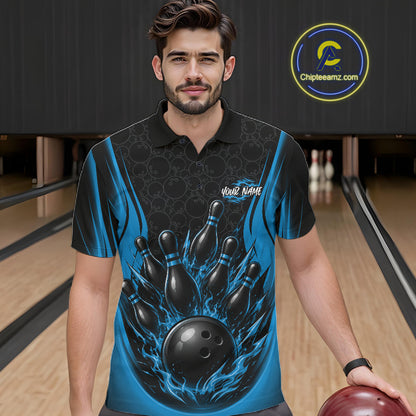 A man wearing a custom bowling-themed polo shirt with a graphic of bowling pins and a bowling ball on a blue and black flame pattern, standing in a bowling alley.