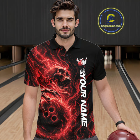Male model wearing a black bowling polo shirt in a bowling alley featuring a skull clutching a bowling ball surrounded by swirling red energy flames