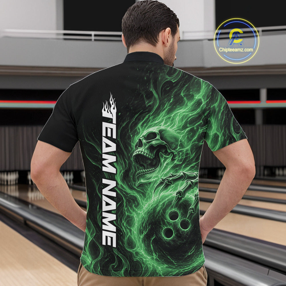 Male model wearing a black bowling quarter-zip shirt in a bowling alley featuring a skull clutching a bowling ball with swirling green energy flames
