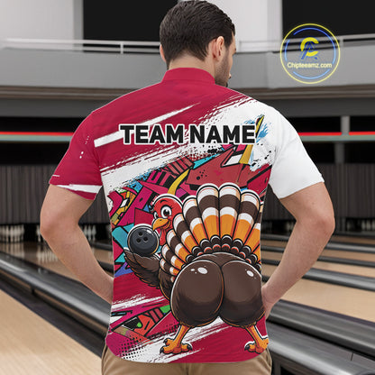 Back view of a male model in a bowling alley wearing a red custom quarter zip bowling shirt with a funny graffiti turkey holding a bowling ball, paint splatter accents, and a personalized name.