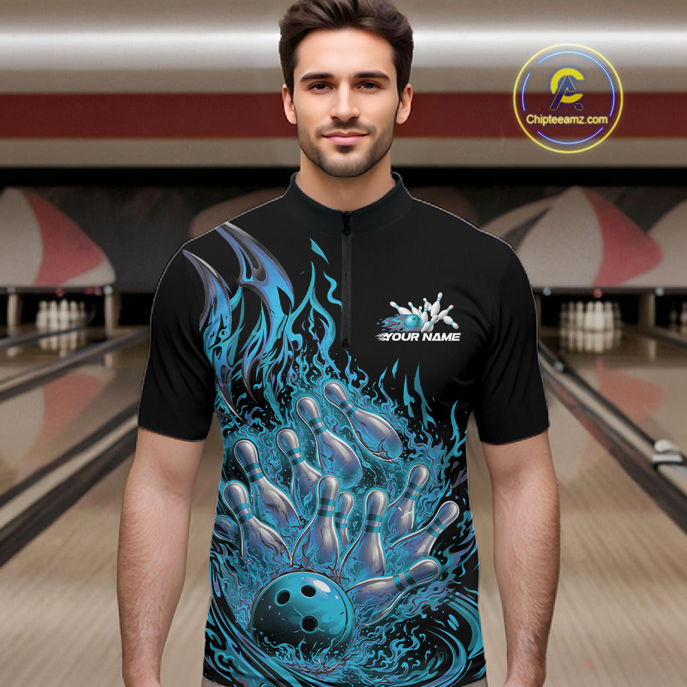 Male model in bowling lane wearing quarter-zip shirt with flaming bowling ball striking pins blue dynamic fire artwork