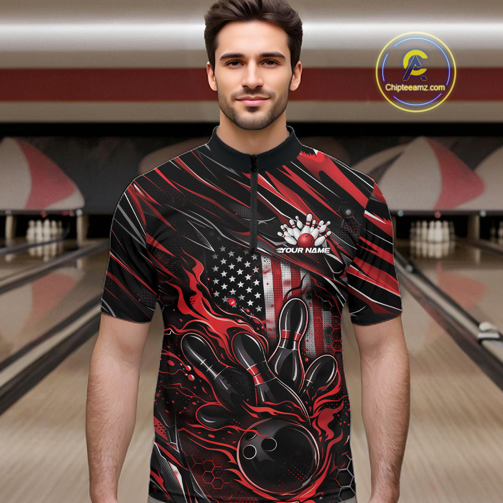 Male model at a bowling lane wearing a black and red bowling quarter-zip shirt with bowling strike artwork and patriotic flame details.