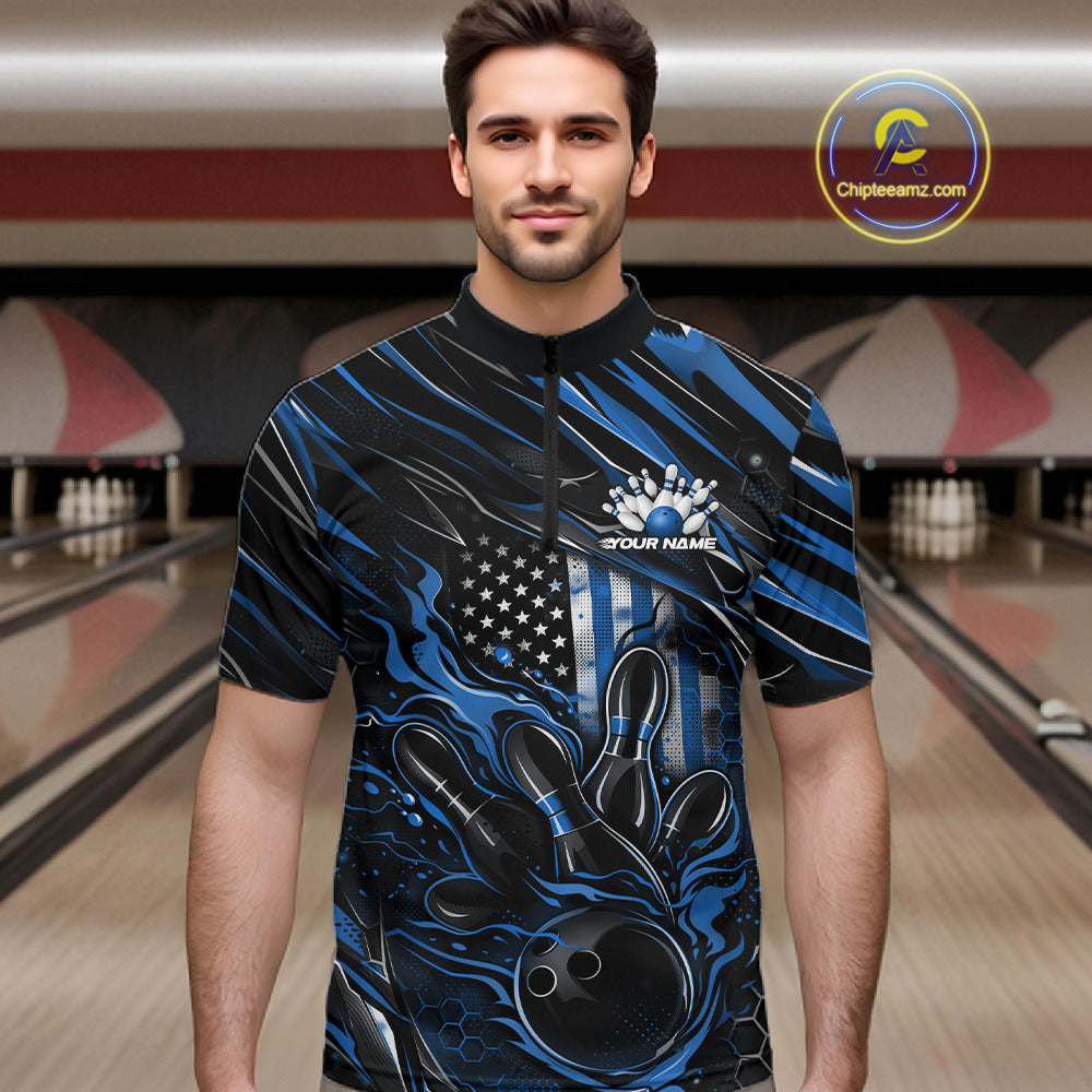 Male model wearing a black and blue bowling quarter-zip shirt at a bowling lane with fiery bowling strike graphics and patriotic accents.