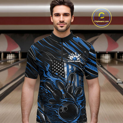 Male model wearing a black and blue bowling quarter-zip shirt at a bowling lane with fiery bowling strike graphics and patriotic accents.