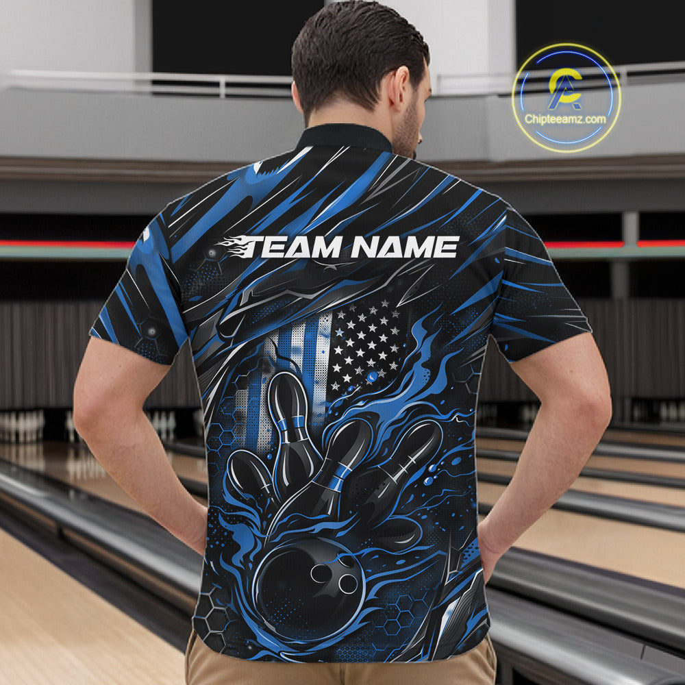 Front view of a male model in a bowling center wearing a black and blue quarter-zip shirt featuring a flaming bowling ball and pin motif.