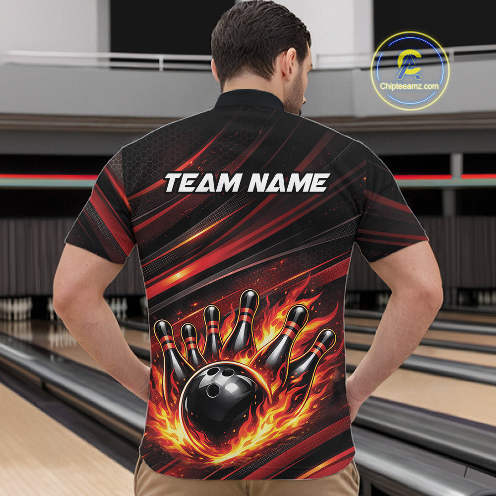 Front view of a male model in a bowling center wearing a black and red-orange quarter-zip shirt featuring a fiery bowling strike scene.