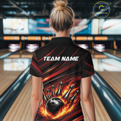 Female model at a bowling lane, back view of black and red orange quarter zip shirt featuring fiery bowling ball striking pins with abstract stripe design