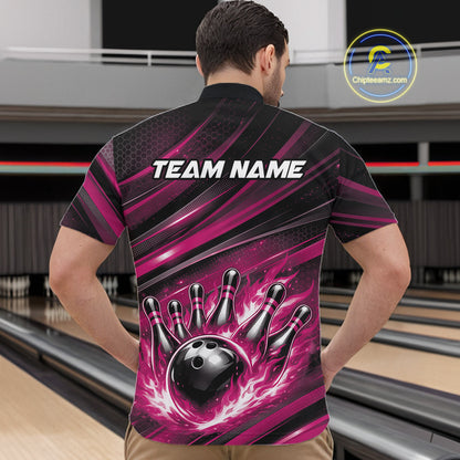 Front view of a male model in a bowling venue wearing a black and pink quarter-zip shirt featuring a flaming bowling ball hitting the pins.