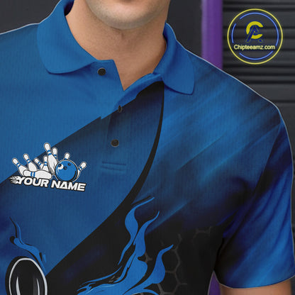 Close-up left chest view of a black and blue bowling polo shirt featuring a flaming bowling ball striking pins over a hexagon pattern.