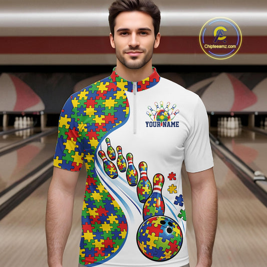 In Bowling Alley, Front View Male Model Wearing White Quarter-Zip Shirt Featuring Autism Awareness Bowling Strike Graphics And Puzzle Inspired Design