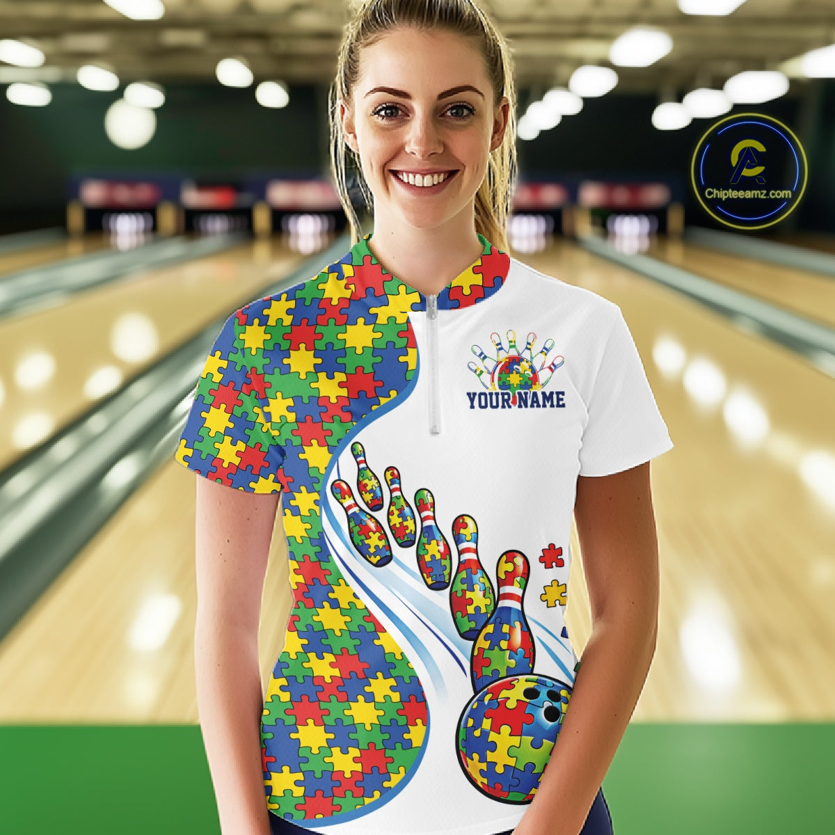 Female model in a bowling lane wearing a white quarter-zip shirt, autism puzzle bowling strike illustration with bright multicolor accents.