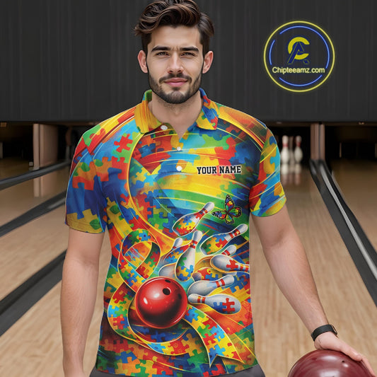 Male model in a bowling lane wearing a colorful polo shirt, front view featuring autism ribbon and puzzle bowling artwork with bright accents