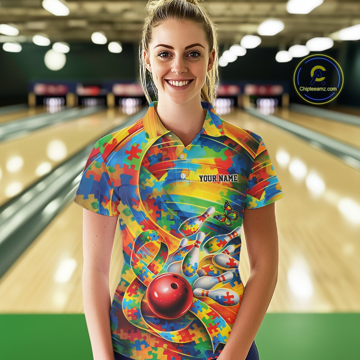 Female model at a bowling lane wearing a colorful polo shirt, front view showing autism puzzle bowling graphics with bright accents