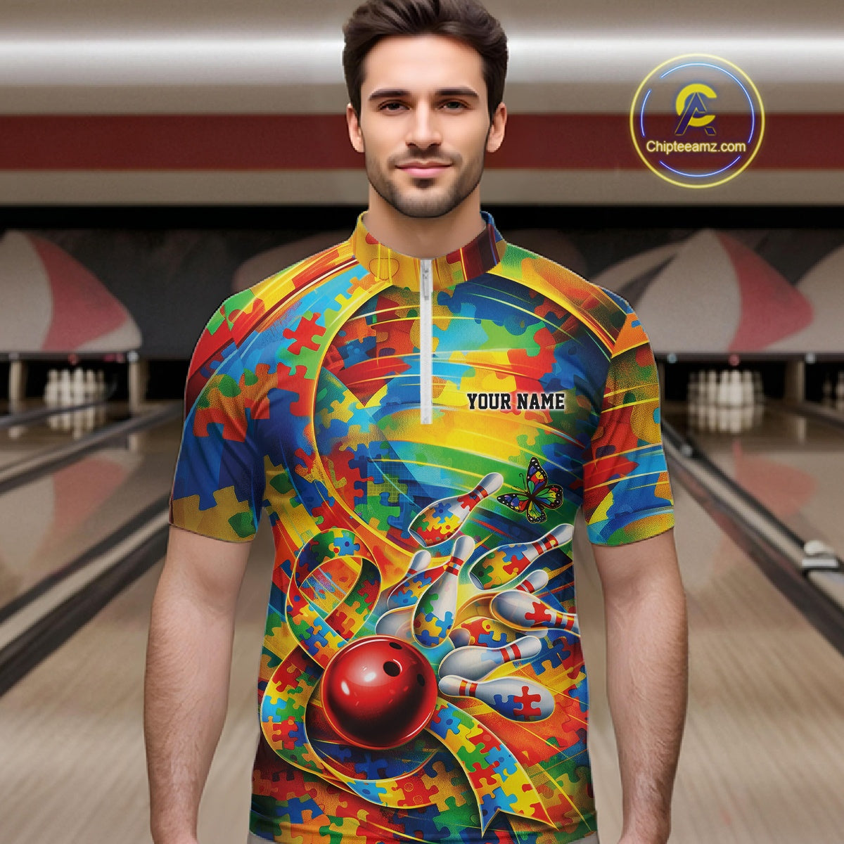 Male model in a bowling lane wearing a colorful quarter-zip shirt, autism puzzle bowling artwork with vibrant multicolor sports graphics.