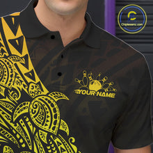 Load image into Gallery viewer, Left chest close-up of a black and gold bowling polo shirt featuring bowling graphics accented by tribal turtle patterns.